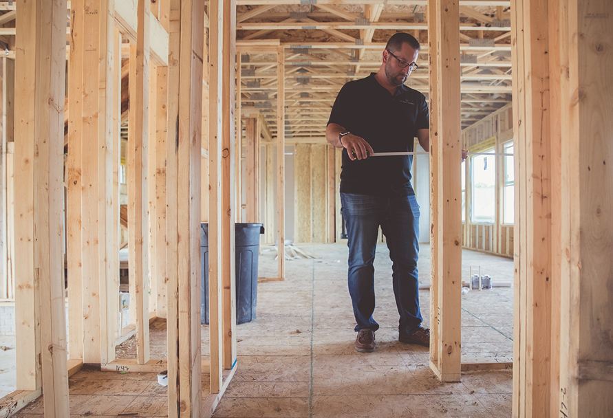 Man working on a house under construction