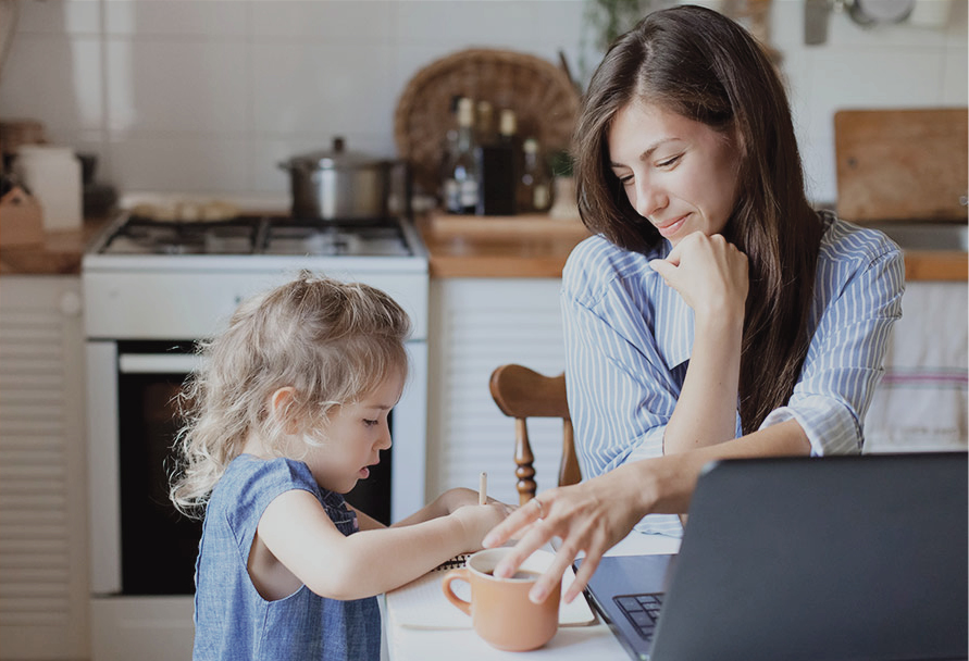 Woman with her child in the kitchen