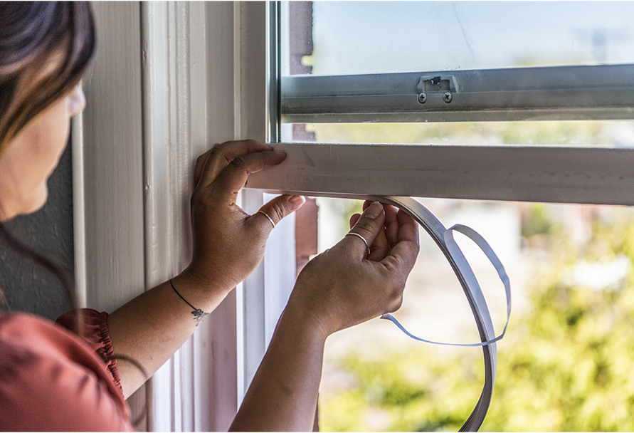 Weather stripping a window